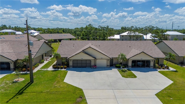 single story home featuring a front lawn and a garage