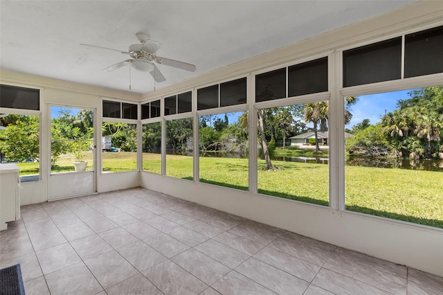 unfurnished sunroom with plenty of natural light and ceiling fan