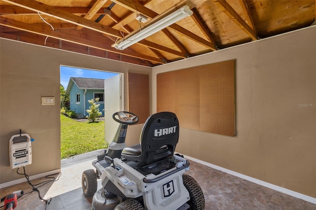 interior space featuring wooden ceiling, heating unit, and lofted ceiling