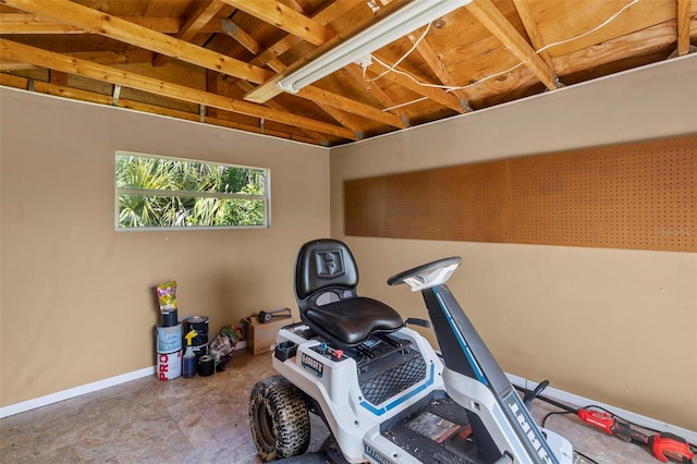 exercise room featuring lofted ceiling