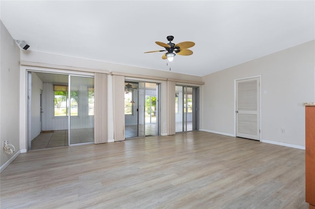 unfurnished room with light hardwood / wood-style floors and ceiling fan