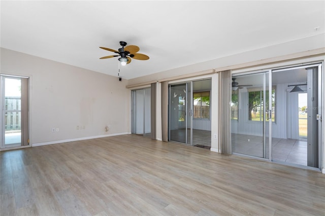 empty room featuring light hardwood / wood-style floors and ceiling fan