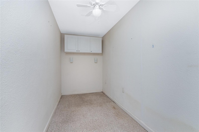 spare room featuring ceiling fan, lofted ceiling, and light colored carpet