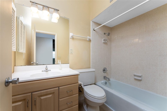 full bathroom with vanity, toilet, and tiled shower / bath