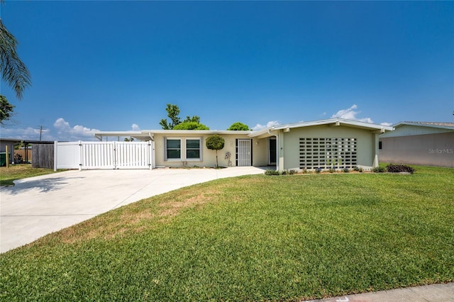 ranch-style home with a front yard