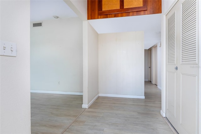 hall with light hardwood / wood-style flooring