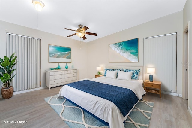 bedroom featuring light hardwood / wood-style floors and ceiling fan