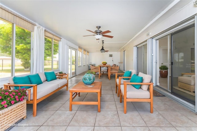 sunroom featuring ceiling fan