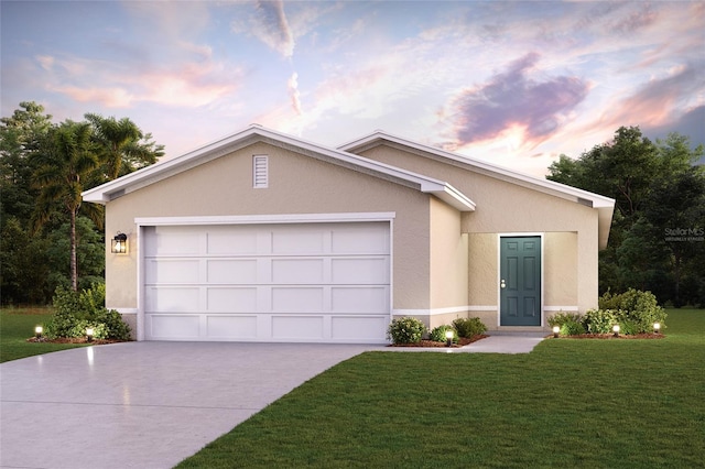 ranch-style home with a yard and a garage