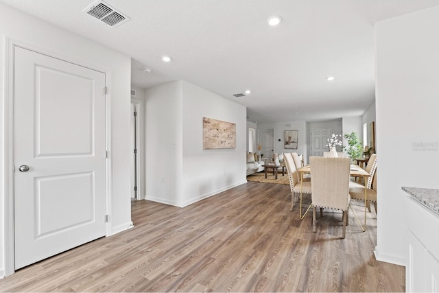 dining space featuring light wood-type flooring