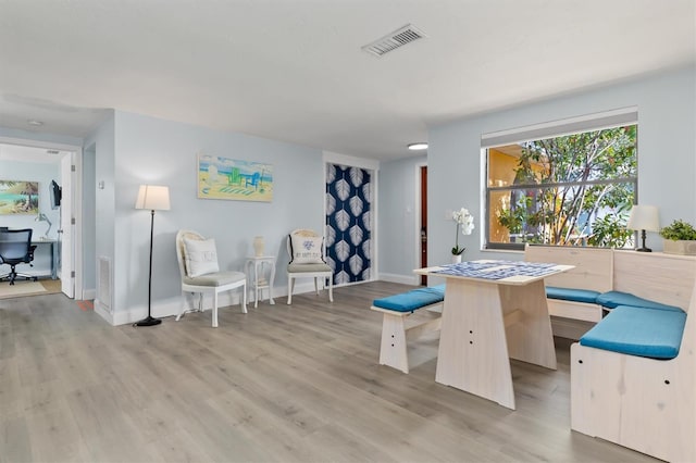 dining area with light wood-type flooring