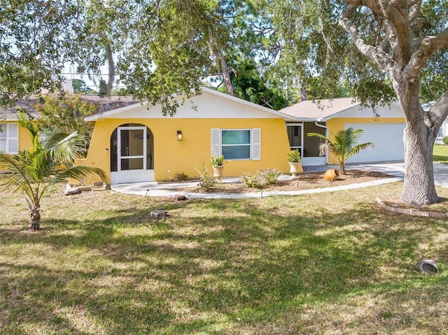 ranch-style house with a front yard and a garage