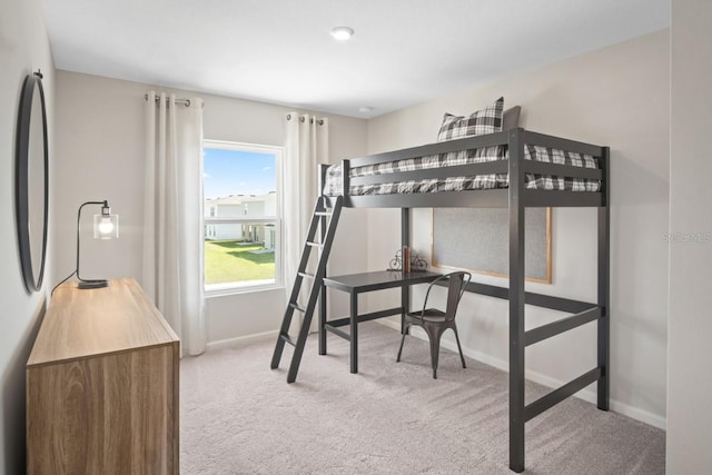 bedroom with light colored carpet