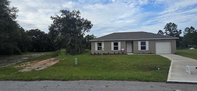 ranch-style house with a garage and a front lawn