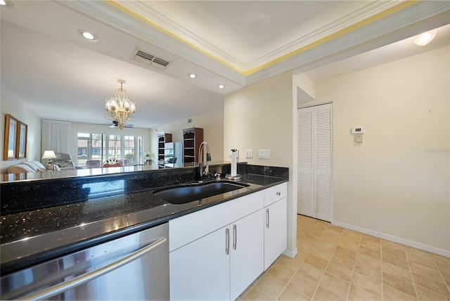 kitchen with white cabinets, an inviting chandelier, sink, dark stone countertops, and dishwasher