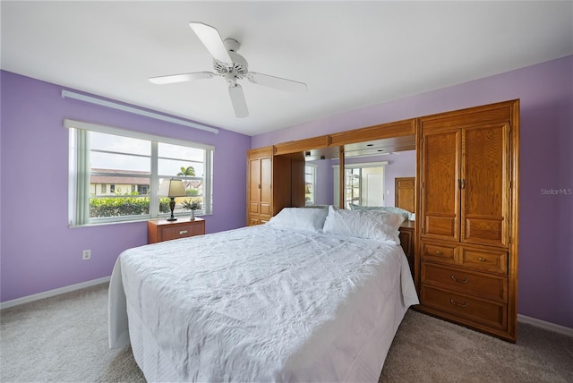 bedroom with ceiling fan and carpet flooring