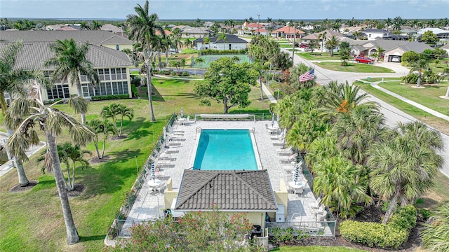 view of pool featuring a yard