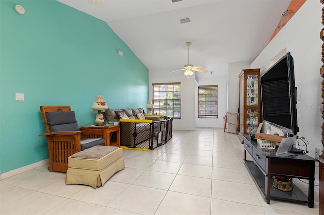 living room featuring tile flooring, lofted ceiling, and ceiling fan