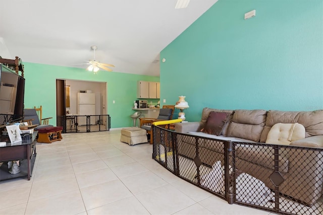 tiled living room featuring ceiling fan and lofted ceiling