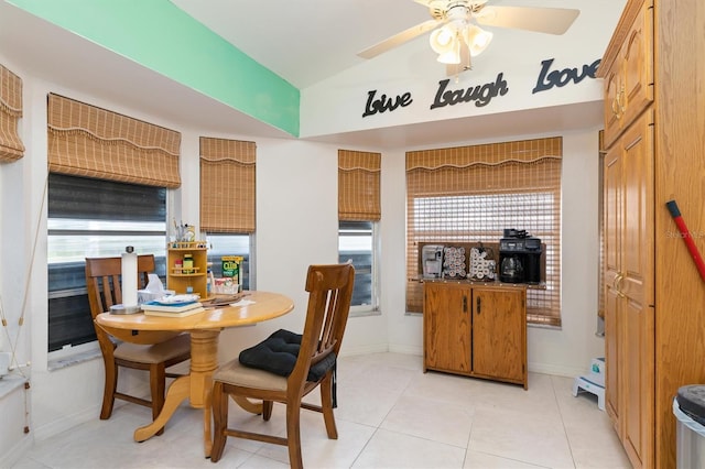 dining space featuring ceiling fan and light tile floors