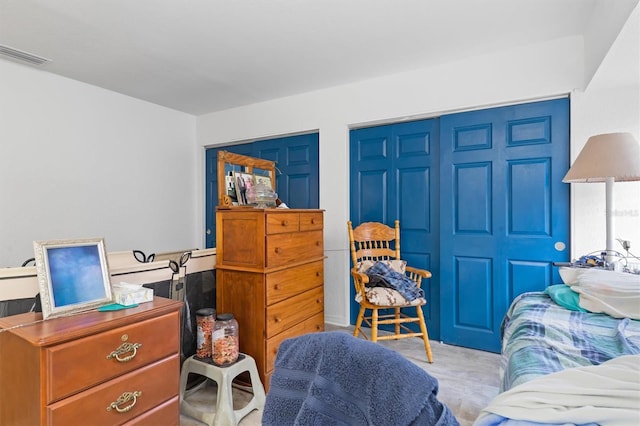 bedroom with light colored carpet