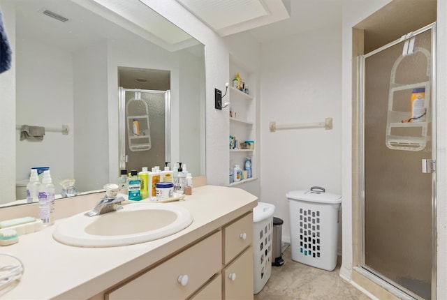 bathroom featuring an enclosed shower, vanity, and tile flooring