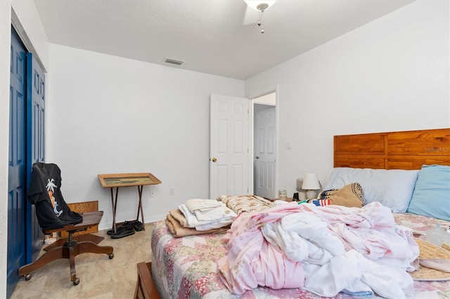 carpeted bedroom with a closet and ceiling fan