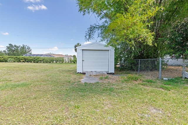 view of yard featuring a storage unit