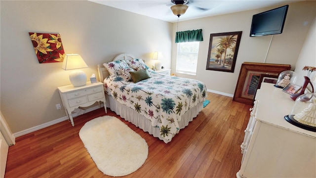 bedroom featuring hardwood / wood-style flooring and ceiling fan