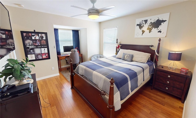 bedroom with ceiling fan and wood-type flooring