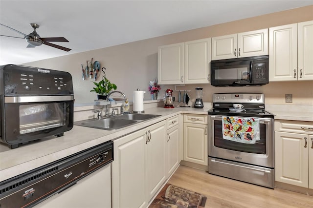 kitchen featuring stainless steel range with electric stovetop, light wood-type flooring, white dishwasher, sink, and ceiling fan