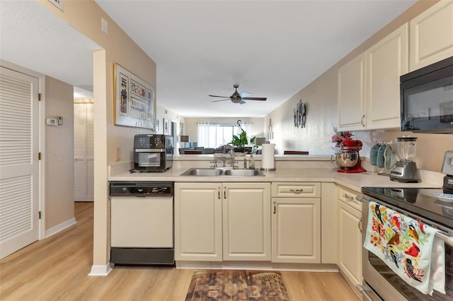 kitchen with ceiling fan, white dishwasher, electric range, sink, and light wood-type flooring