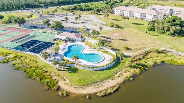 birds eye view of property with a water view