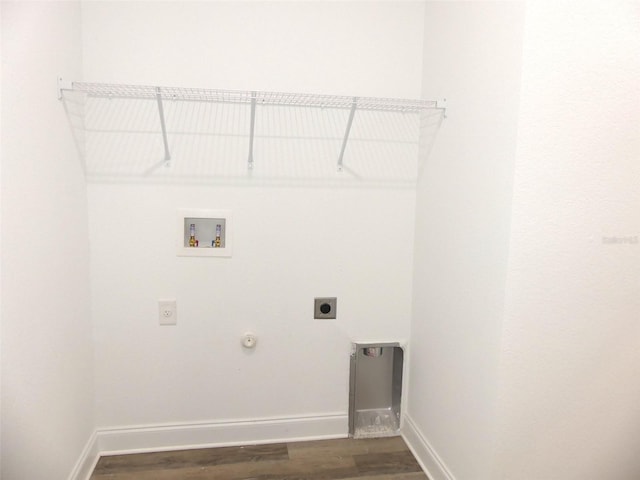 washroom featuring hookup for a gas dryer, dark hardwood / wood-style flooring, washer hookup, and hookup for an electric dryer