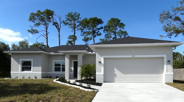 ranch-style home with a front yard and a garage