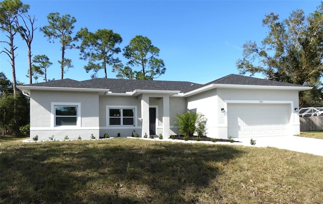 view of front facade featuring a front yard and a garage