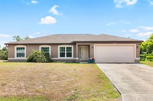 single story home with a front lawn and a garage