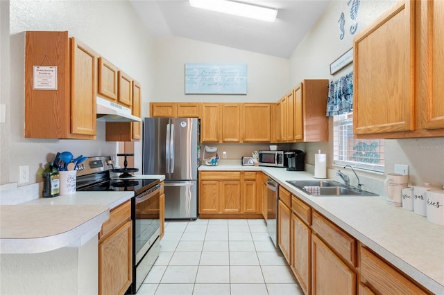 kitchen featuring appliances with stainless steel finishes, light tile patterned flooring, sink, and lofted ceiling