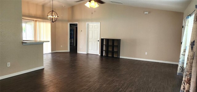 unfurnished living room with high vaulted ceiling, ceiling fan with notable chandelier, and dark hardwood / wood-style floors