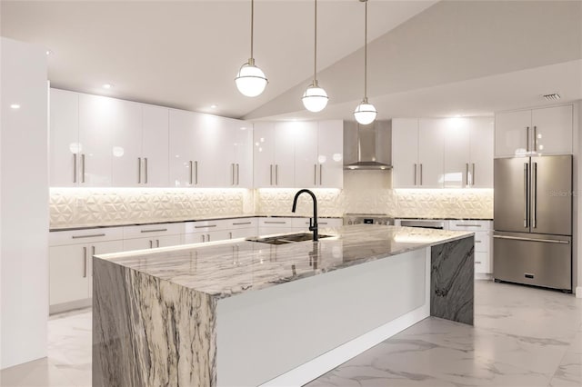 kitchen featuring sink, white cabinets, vaulted ceiling, and appliances with stainless steel finishes