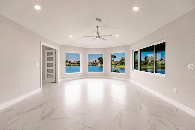 empty room featuring a water view and ceiling fan