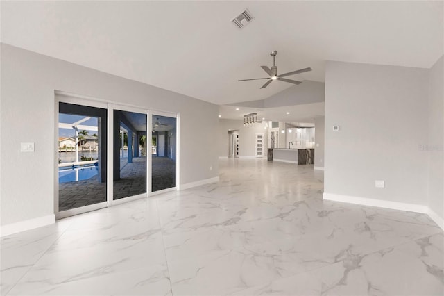 unfurnished living room featuring ceiling fan and lofted ceiling