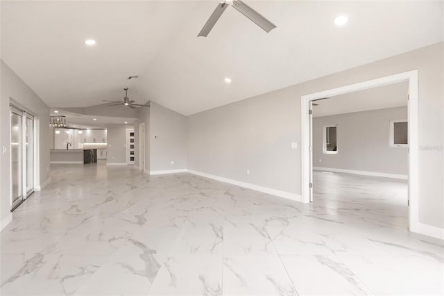 unfurnished living room with ceiling fan and lofted ceiling