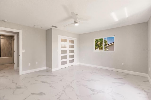 spare room featuring ceiling fan