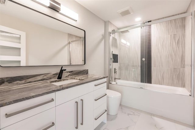 full bathroom with combined bath / shower with glass door, vanity, and toilet