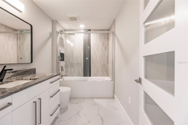 full bathroom featuring combined bath / shower with glass door, vanity, and toilet