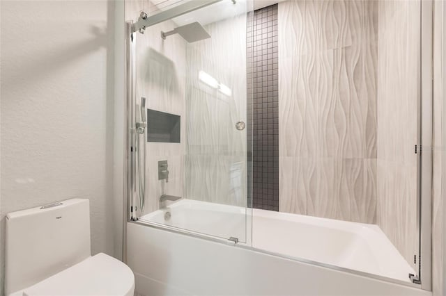 bathroom featuring toilet and enclosed tub / shower combo