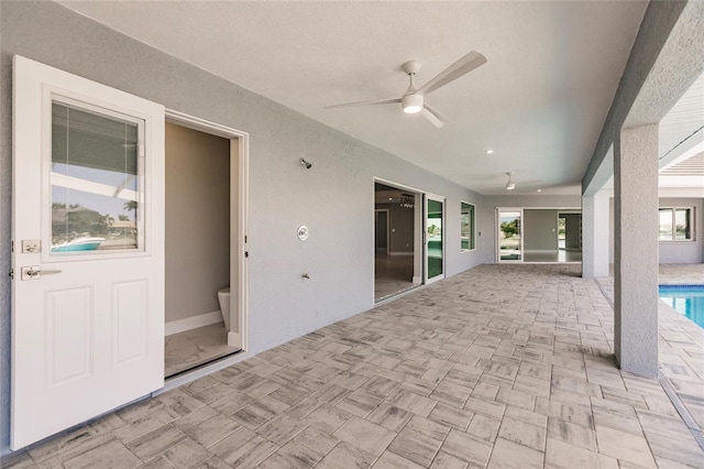 view of patio / terrace featuring ceiling fan