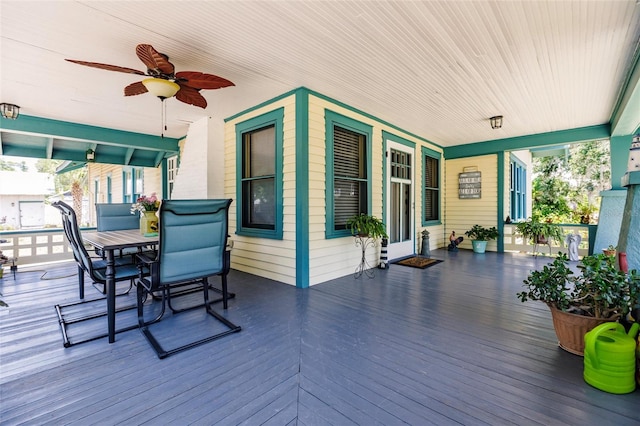 wooden deck featuring ceiling fan