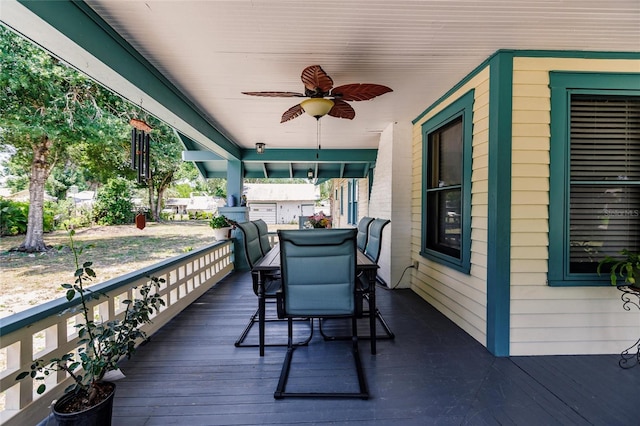 wooden terrace featuring ceiling fan